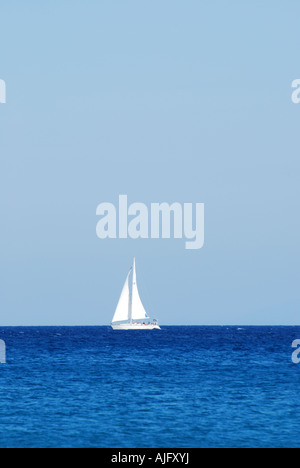 A lone yacht on the horizon of the greek mediterranean sea off the coast of Kephalonia number 2561 Stock Photo