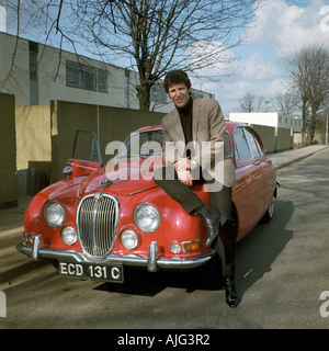TOM JONES Welsh singer in 1967 with his Jaguar saloon outside his home in Shepperton near London. Photo: Tony Gale Stock Photo