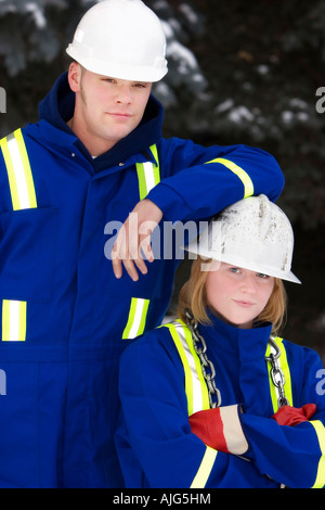 Tradesman and junior tradeswoman Stock Photo