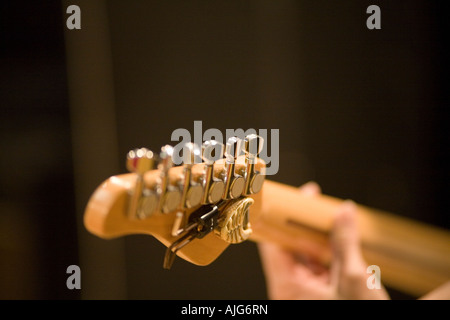 Young man playing electric guitar Stock Photo