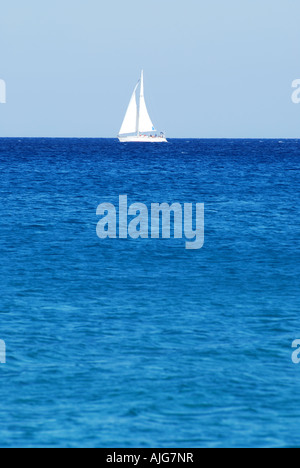 A lone yacht on the horizon of the greek mediterranean sea off the coast of Kephalonia number 2562 Stock Photo