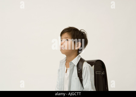 Elementary age boy looking up Stock Photo