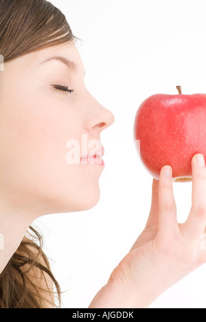 Young woman holding apple Stock Photo