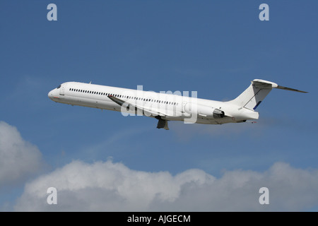 Commercial air travel. McDonnell Douglas MD-83 passenger jet plane in the air. No livery and proprietary markings removed. Stock Photo
