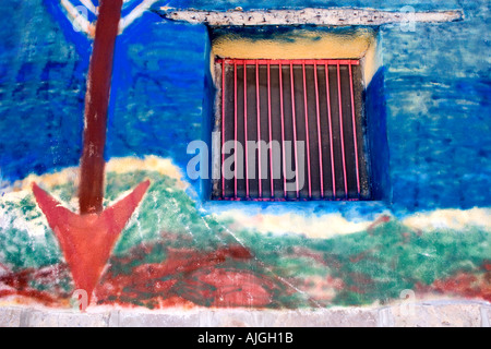 Artwork painted on the side of an adobe wall in Tucson s barrio district Stock Photo