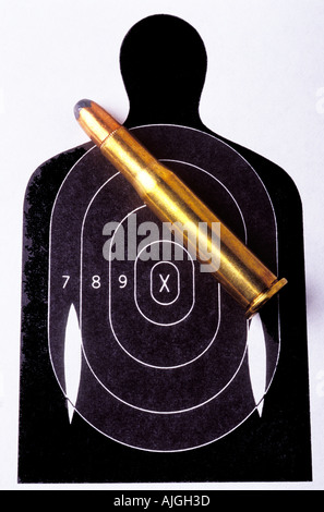 Rifle bullet on target that looks like outline of a human Stock Photo