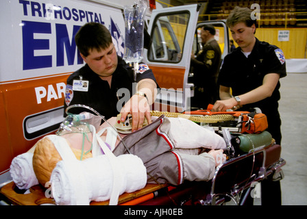 Career Fair Paramedics demonstrate the use of heart paddles Stock Photo
