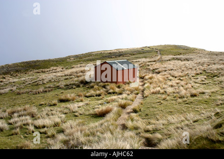 Back country Hut in golden tussock land at Mt Roberts Nelson Lakes National Park South Island New Zealand Stock Photo
