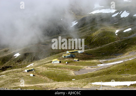 Watching the mist rise at Mt Roberts Skiing area Nelson Lakes National Park South Island New Zealand Stock Photo