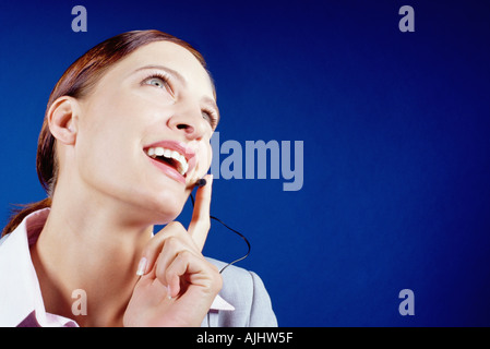 Businesswoman using telephone headset Stock Photo