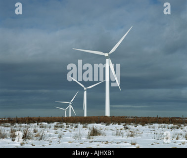 Wind turbines in snowy field Stock Photo