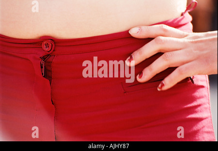 Young woman wearing red trousers Stock Photo