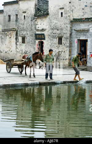 Horse and Cart Huizhou Architecture Reflected in Moon Pond Hongcun Village Yixian Province China Stock Photo