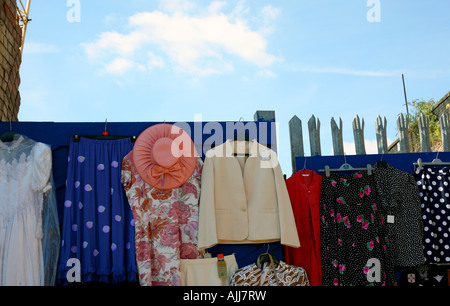 Secondhand clothing for sale in Brick Lane street market London Stock Photo