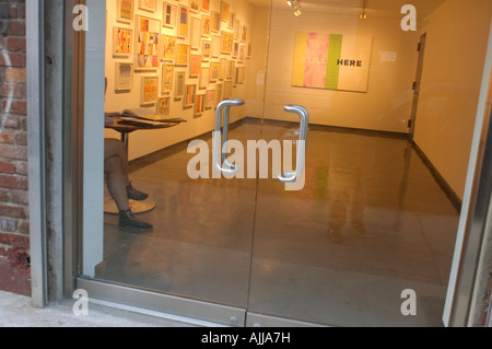 A gallery sitter waits for art lovers in the Paul Kasmin Gallery s annex in the trendy Chelsea gallery district in NYC Stock Photo