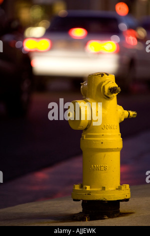 Yellow American Jones water fire hydrant on busy street corner in Pasadena, California, USA. Stock Photo