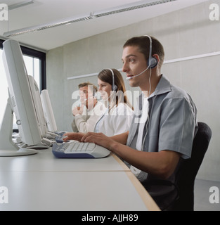 Three call centre operators Stock Photo