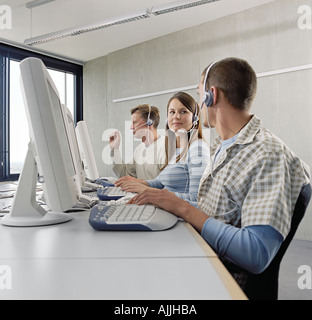 Three call centre operators Stock Photo