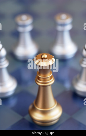 Chess pieces queen making first move Stock Photo