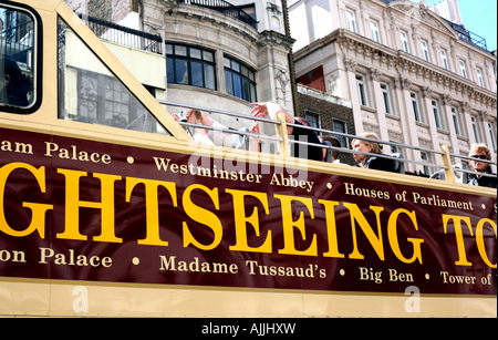 Sightseers take photos on tourist bus in London Stock Photo
