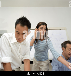 Three office workers Stock Photo