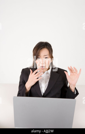 Young woman working on computer Stock Photo