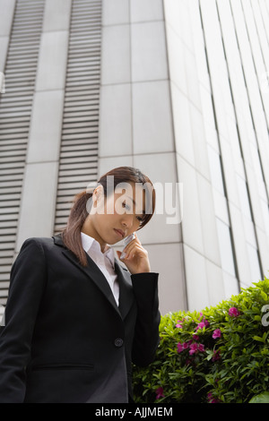Young woman using mobile phone Stock Photo