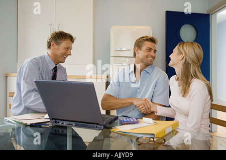 Couple and financial adviser Stock Photo