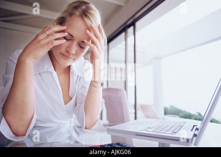 Woman looking stressed Stock Photo