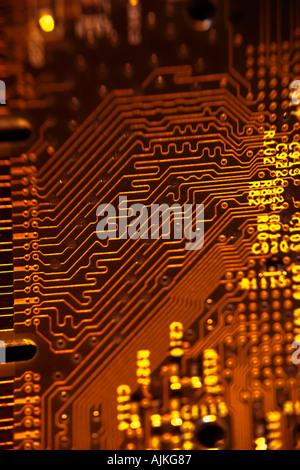 Circuit Board traces in orange Stock Photo