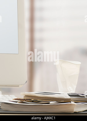 Crumpled paper cup on desk Stock Photo - Alamy