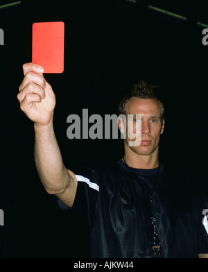 Referee holding a red card Stock Photo