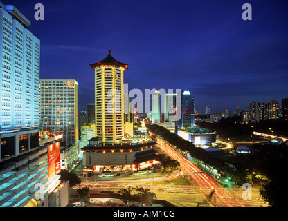 Dynasty Hotel with Wisma Atria on Orchard Road in Singapore Stock Photo