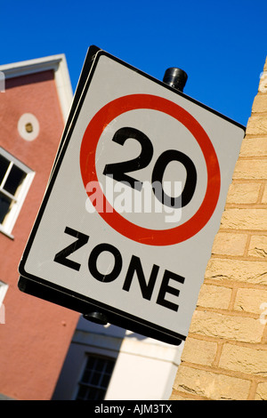 Road sign in 20 mph zone in a British town to inform drivers of speed limit in a built up area used by pedestrians and children Stock Photo