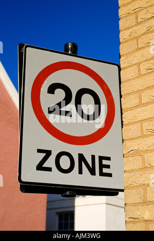 Road sign in 20 mph zone in a British town to inform drivers of speed limit in a built up area used by pedestrians and children Stock Photo