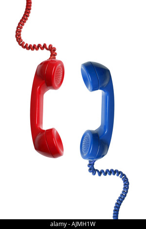 Red and Blue telephone receivers cut out on white background Stock Photo