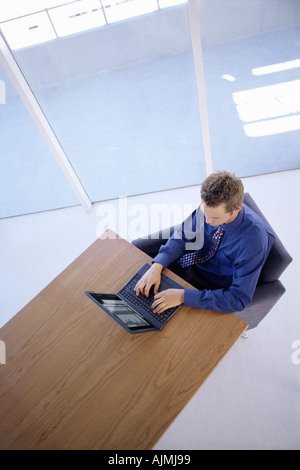 Office worker using laptop computer Stock Photo