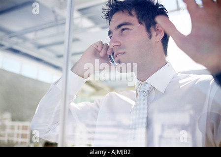 Office worker on mobile phone Stock Photo