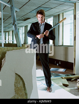 Businessman holding baseball bat Stock Photo