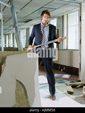 Businessman holding baseball bat Stock Photo