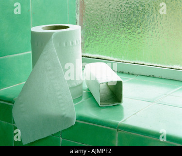 Toilet rolls on windowsill Stock Photo