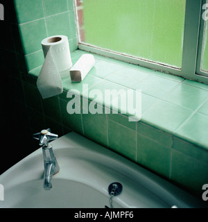 Toilet rolls on windowsill Stock Photo