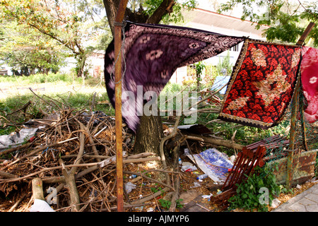 Batik Sarongs dry by the roadside on the main tourist stretch in Batu Ferringhi, Penang Island, Malaysia. Stock Photo