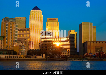 canary wharf shot from across the river thames night evening illuminated office blocks london england uk europe Stock Photo