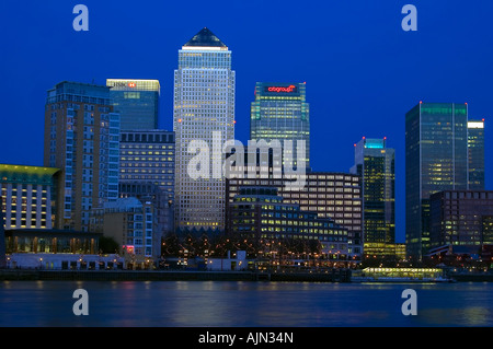 canary wharf shot from across the river thames night evening illuminated office blocks london england uk europe Stock Photo