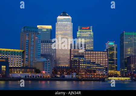 canary wharf shot from across the river thames night evening illuminated office blocks london england uk europe Stock Photo