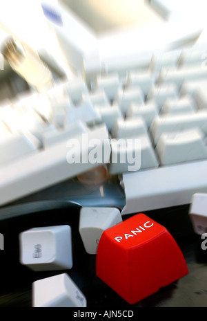 RED PANIC BUTTON ON BROKEN COMPUTER Stock Photo