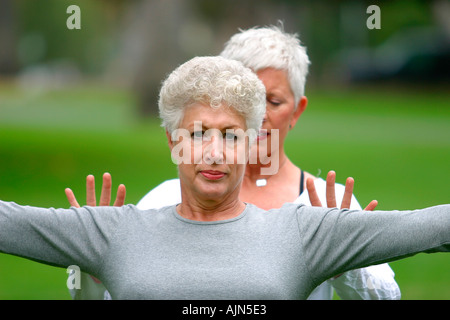 MIDDLE AGED WOMEN DOING YOGA EXERCISE Stock Photo