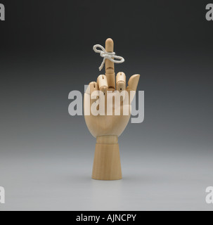 artist wooden hand with knot on finger Stock Photo