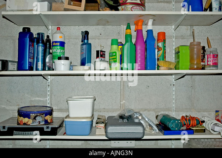 a garage shelf full of bottles and tools Stock Photo